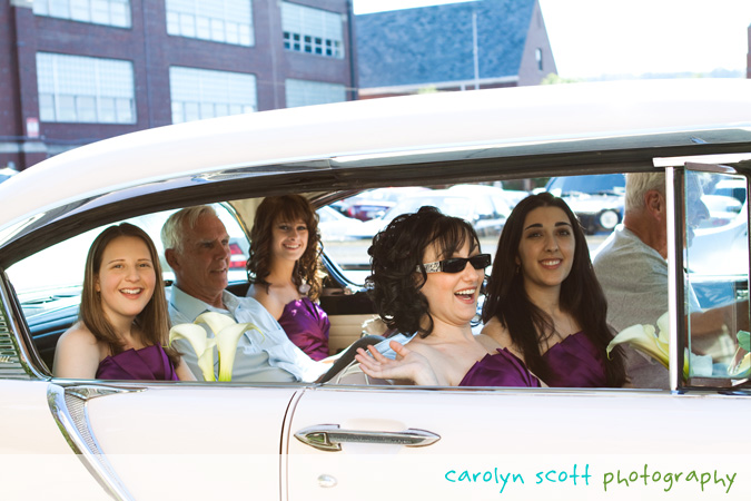 bridesmaids in a classic car