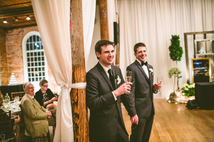 Couple reacting to speeches and toasts at wedding
