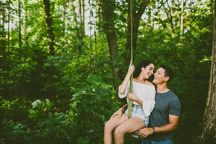 Couple on tree swing engagement session
