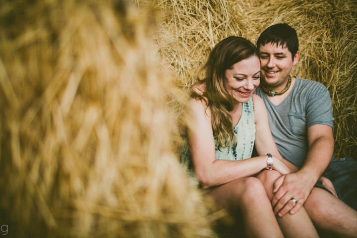 Couple sitting in hay