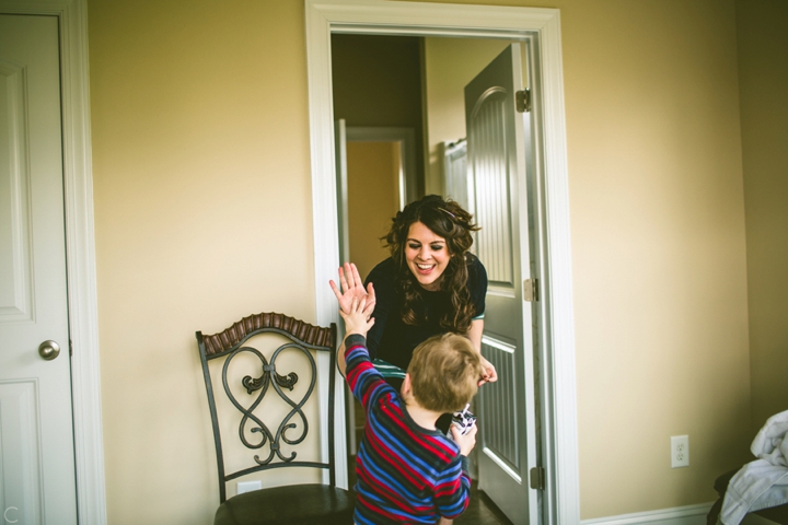 Ringbearer high-fiving bridesmaid