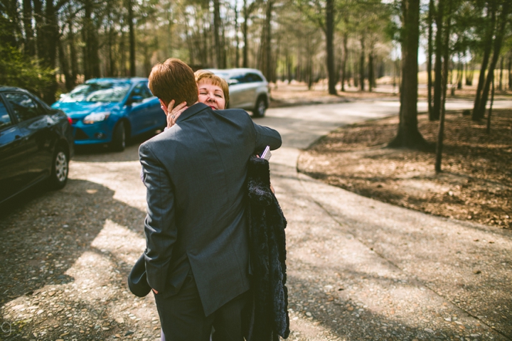 Groom hugging mother