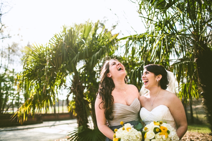 Bride and maid of honor laughing