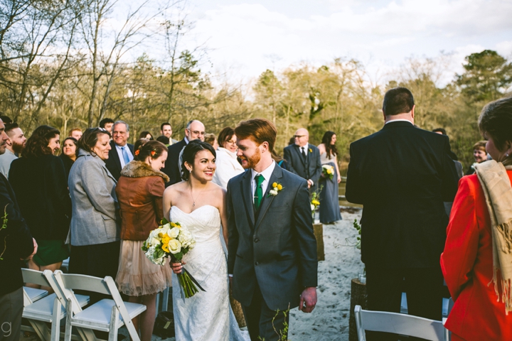 Recessing down wedding aisle