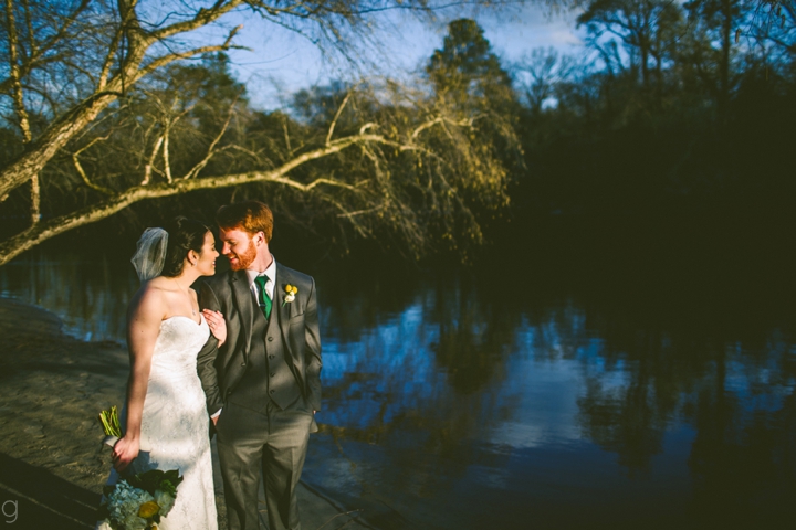 Bride and groom portrait near water