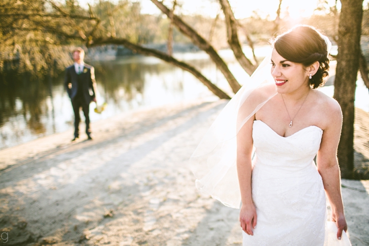 Bride laughing on beach