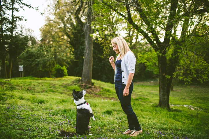 Woman teaching dog tricks