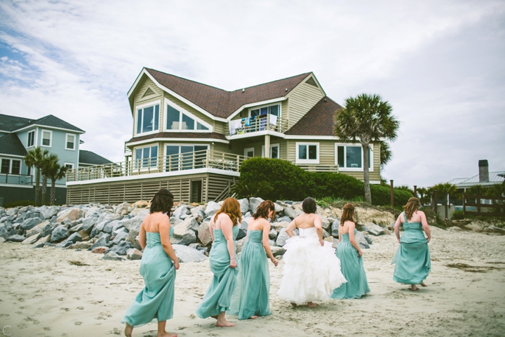 Bridesmaids walking on beach