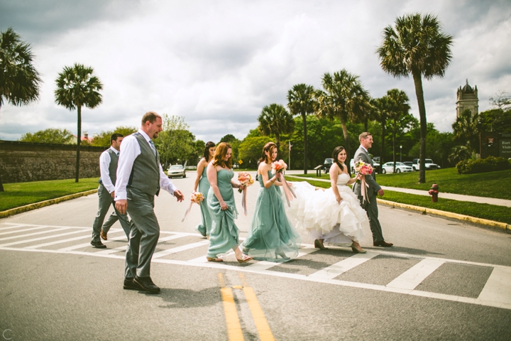 Wedding party walking across street