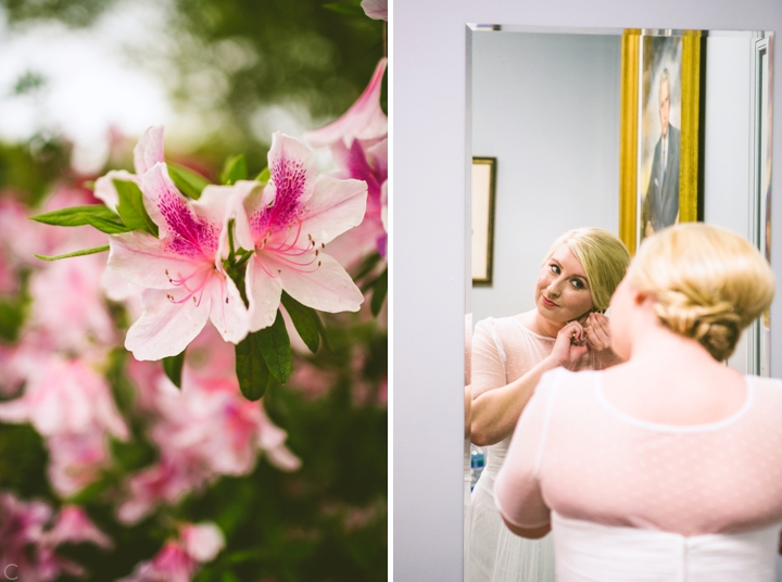 Bride putting on earrings