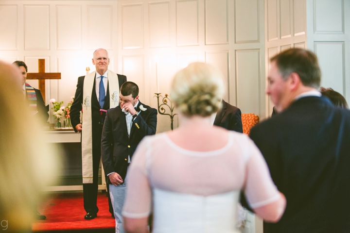 Groom's reaction to bride walking down aisle