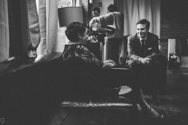 Groom talking to bridesmaid