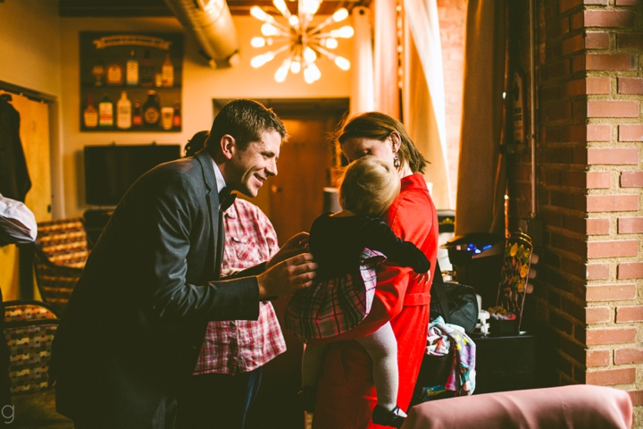 Groom talking to flower girl