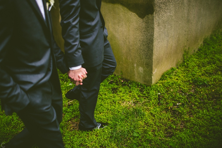 Grooms holding hands