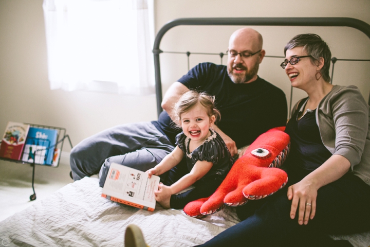 parents reading with daughter