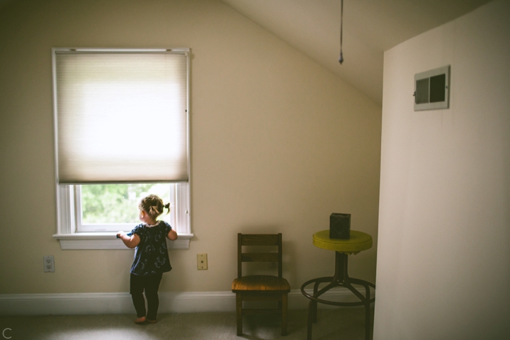 girl looking out window