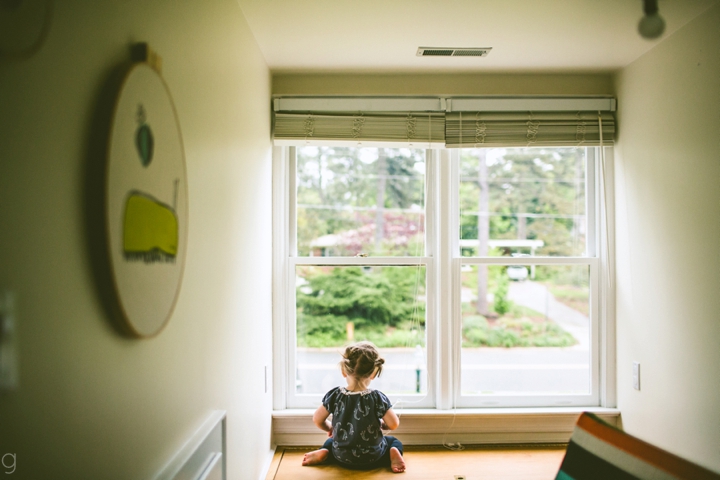 child looking out window