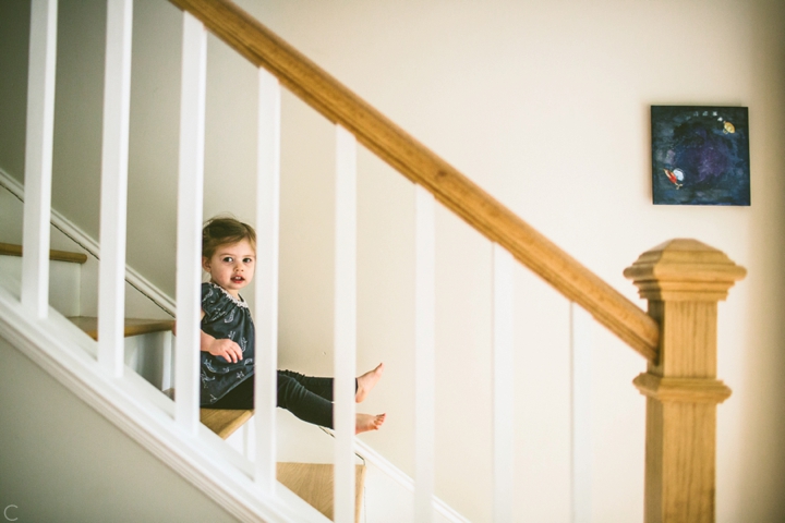 little girl sitting on stairs