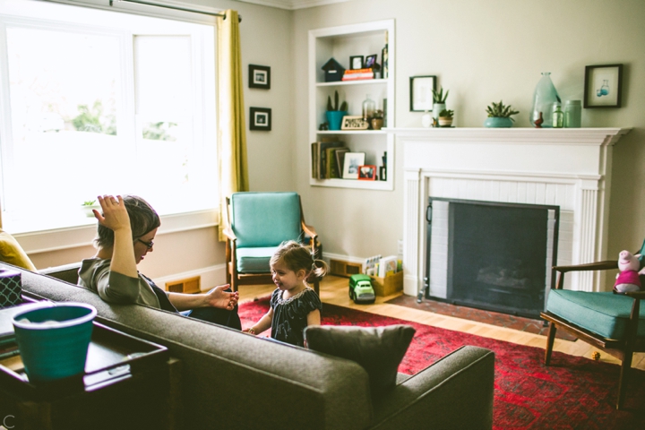 daughter talking to mom in living room