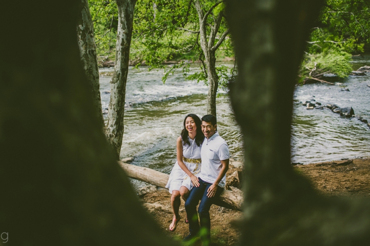 couple sitting on log