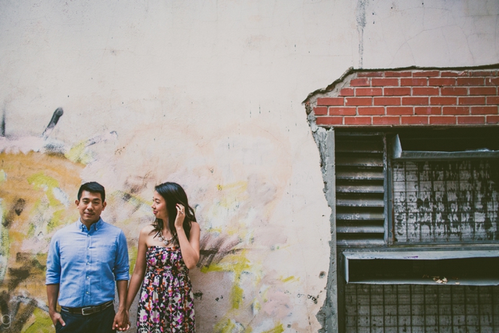 couple standing by wall