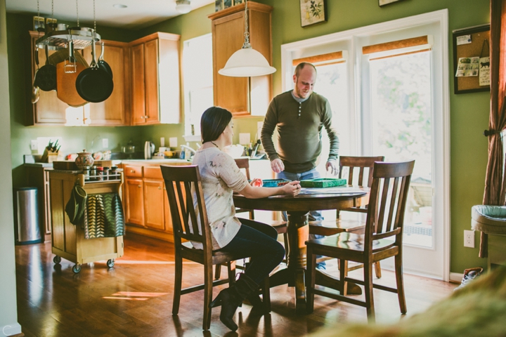 Couple sitting in kitchen