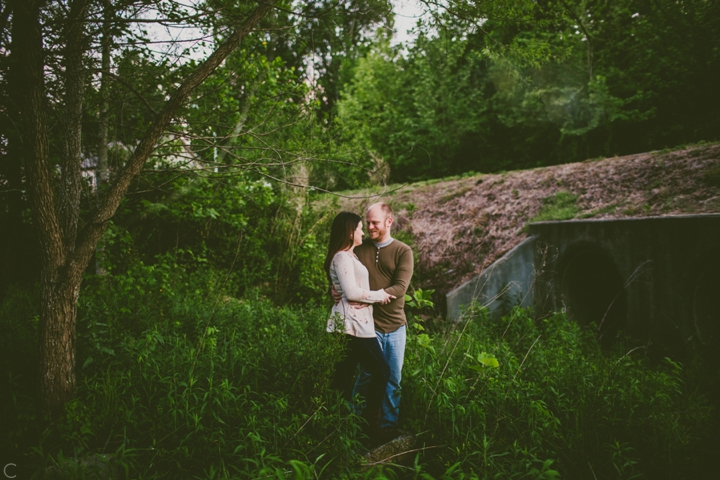 Couple standing in woods