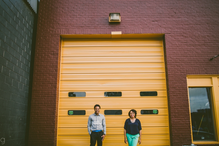 Couple standing in front of garage door