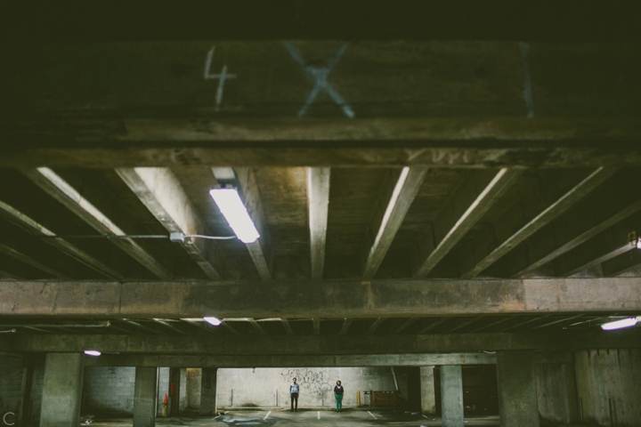 Couple standing in parking garage