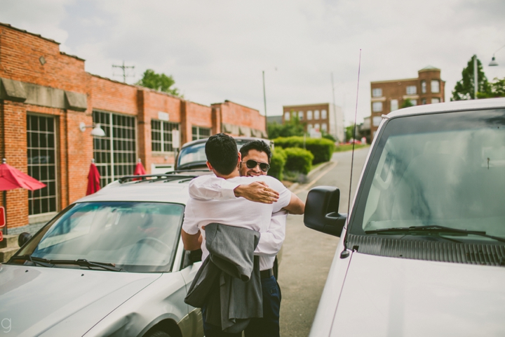 Groom hugging best man