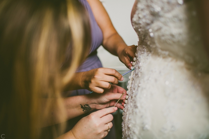 Putting on wedding dress