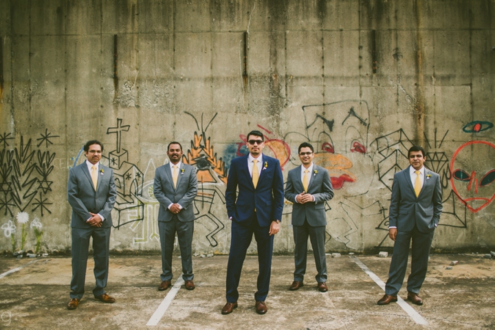 Groomsmen by graffiti wall in Durham, North Carolina