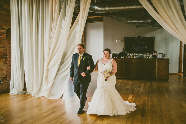 Bride walking down the aisle with father