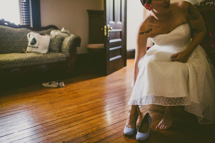 Bride putting on shoes