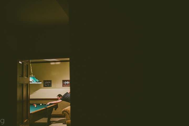 Groomsman playing pool