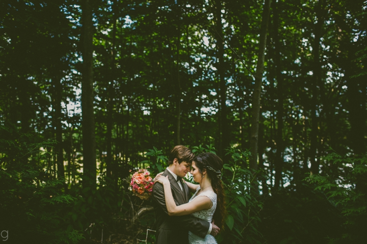 Bride and groom in woods