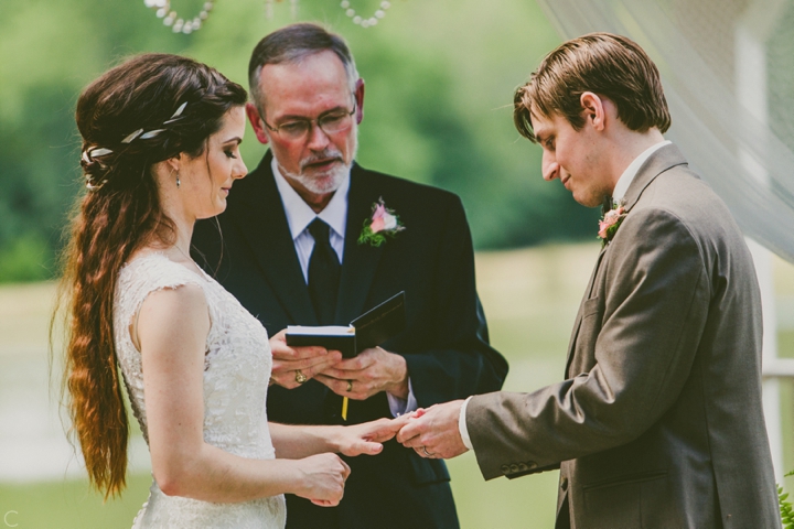 Bride and groom exchanging rings