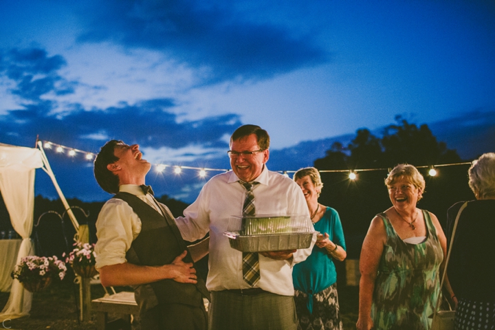 Groom and dad laughing