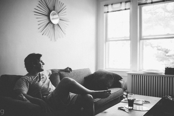 Groom sitting on couch