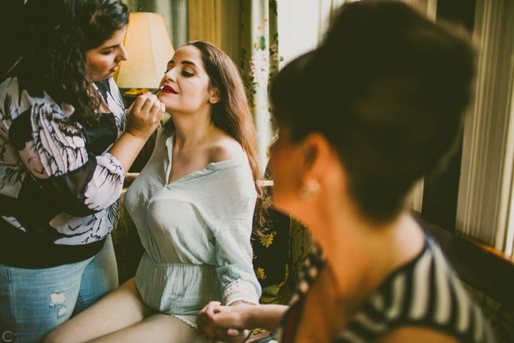 bride putting on makeup