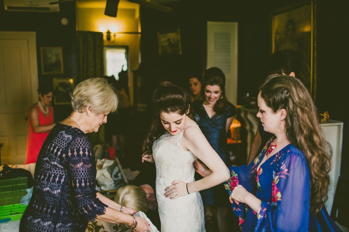 bride putting on dress