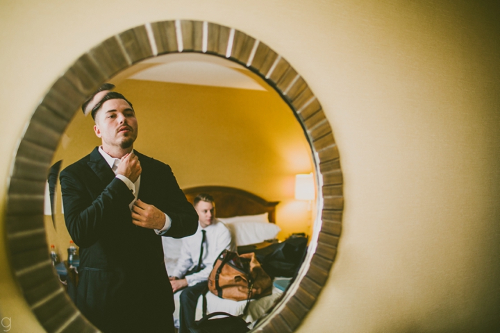 groom putting on bow tie