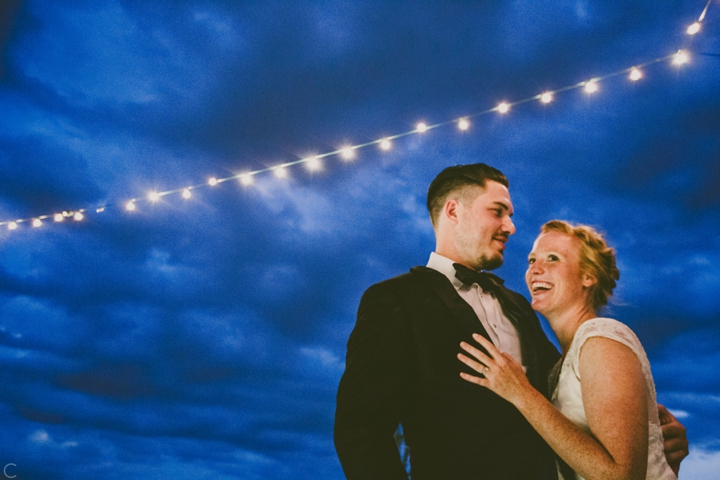 bride and groom string lights