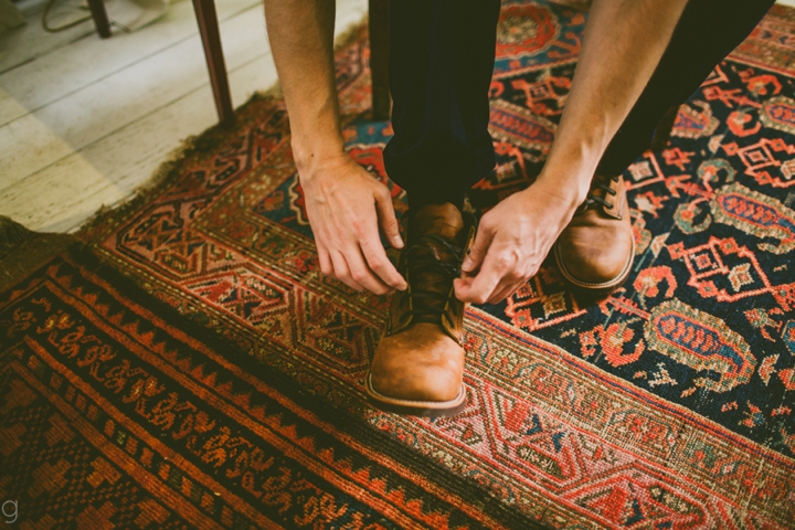 Groom tying shoes