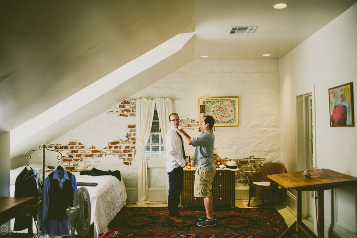 Groom getting dressed for wedding