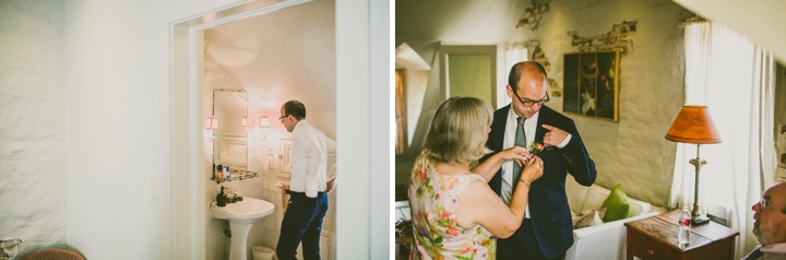 Mother pinning boutonniere onto son