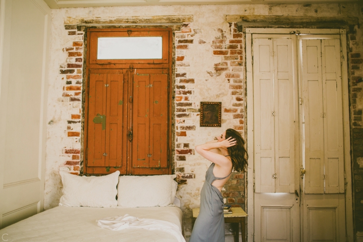 Bride putting on dress