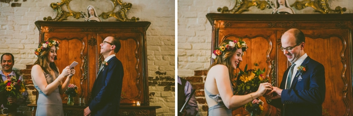 Bride putting ring on groom