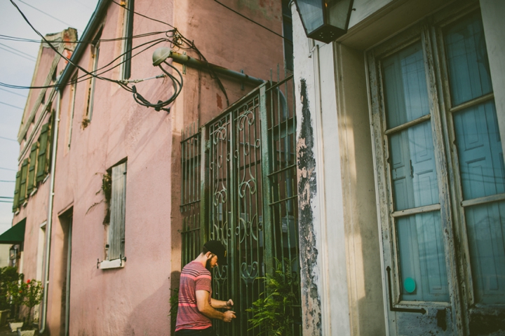 guy opening gate in nola