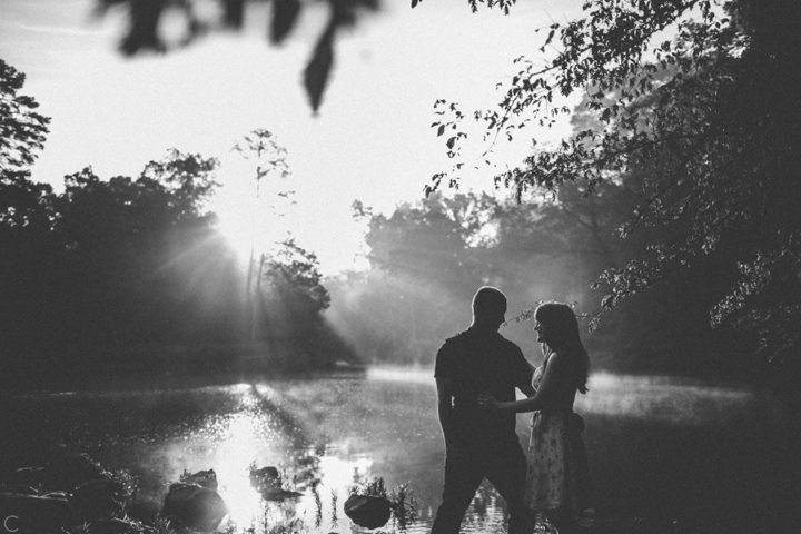 Couple silhouette against river and fog